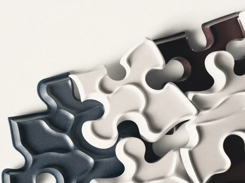Illustration générée d'un détail de matière évoquant l'atelier de puzzles